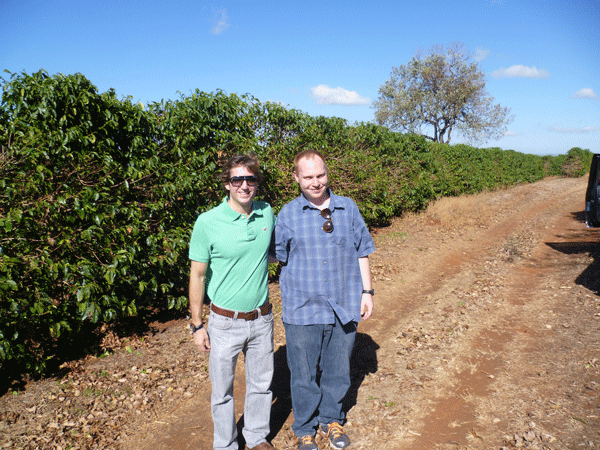 Jon and Nilton in front of coffee field