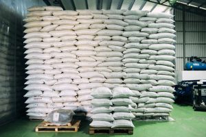 Large sacks of coffee beans stacked to warehouse ceiling at las lajas