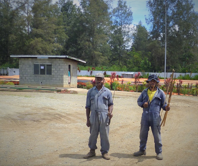 Security guards at Sigri Estate with bows and arrows in Papua New Guinea