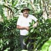 Man standing with coffee plant at Jinotega Paraiso in Nicaragua
