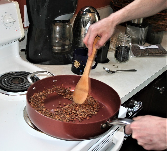 roasting coffee in large pan