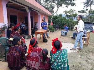 Workers sitting in a circle talking in Guatemala