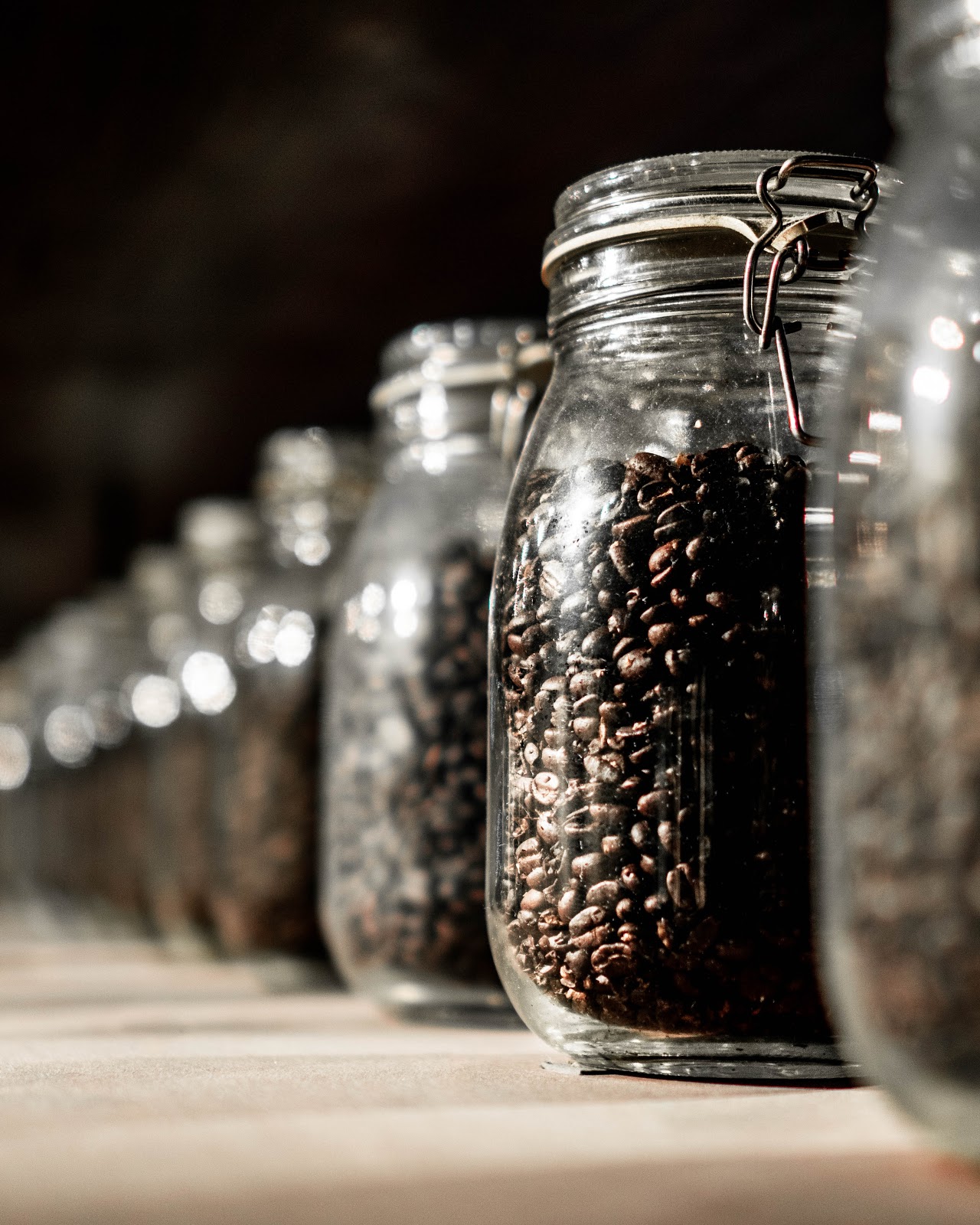 Roasted coffee beans stored in a glass jar