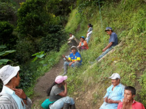 People resting on a hilside in Colombia