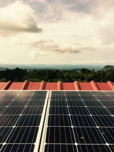 Solar panels on Damarli's roof with landcape view in Panama