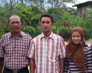 The Junus Family posing outside at Takengon in Indonesian Sumatra