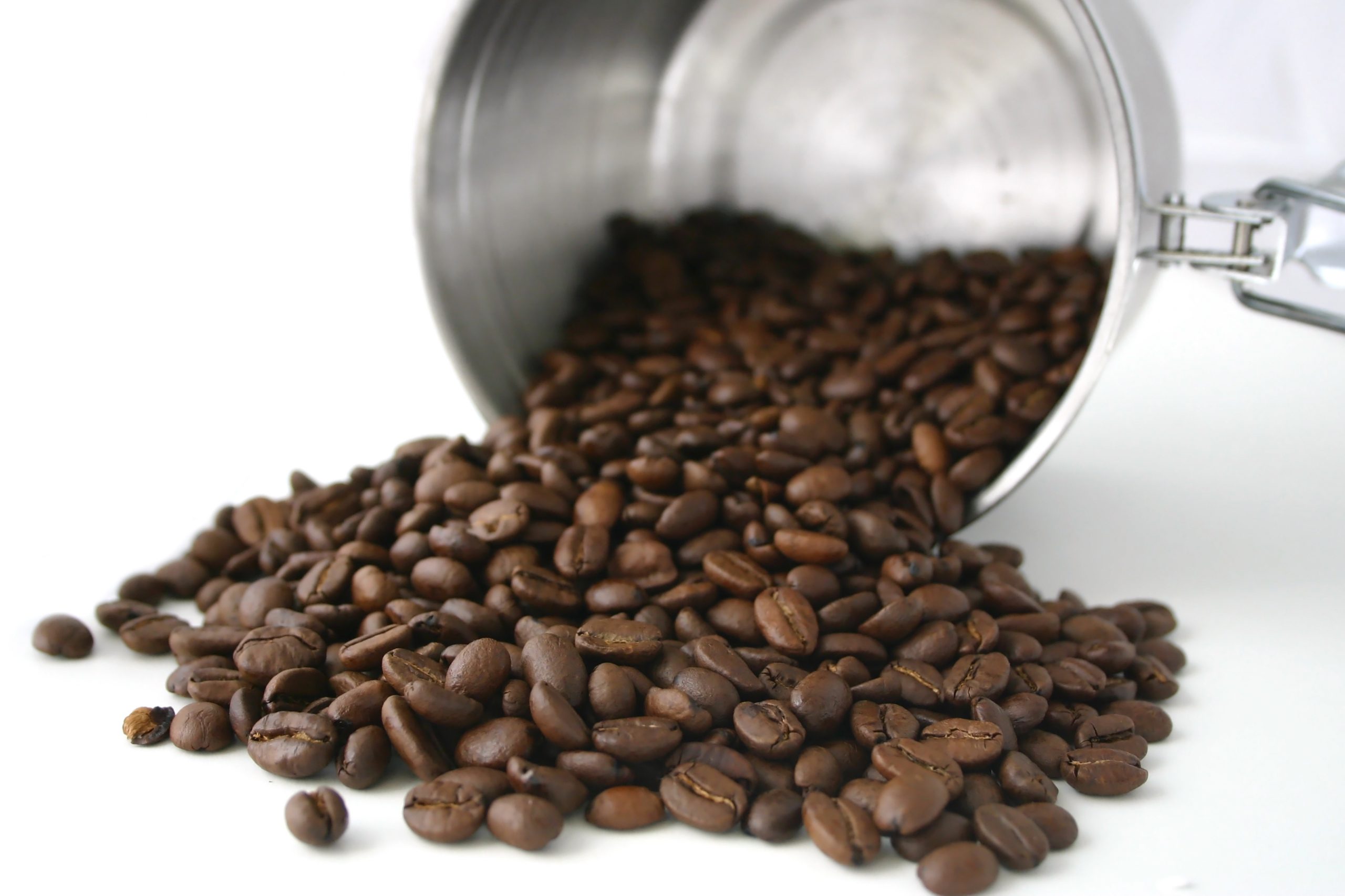 Coffee beans spilling from coffee storage container