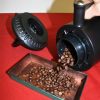 Pouring out roasted coffee beans from a Nesco Roaster