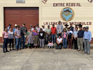 Workers and family posing at Entre Rios Coopertiva