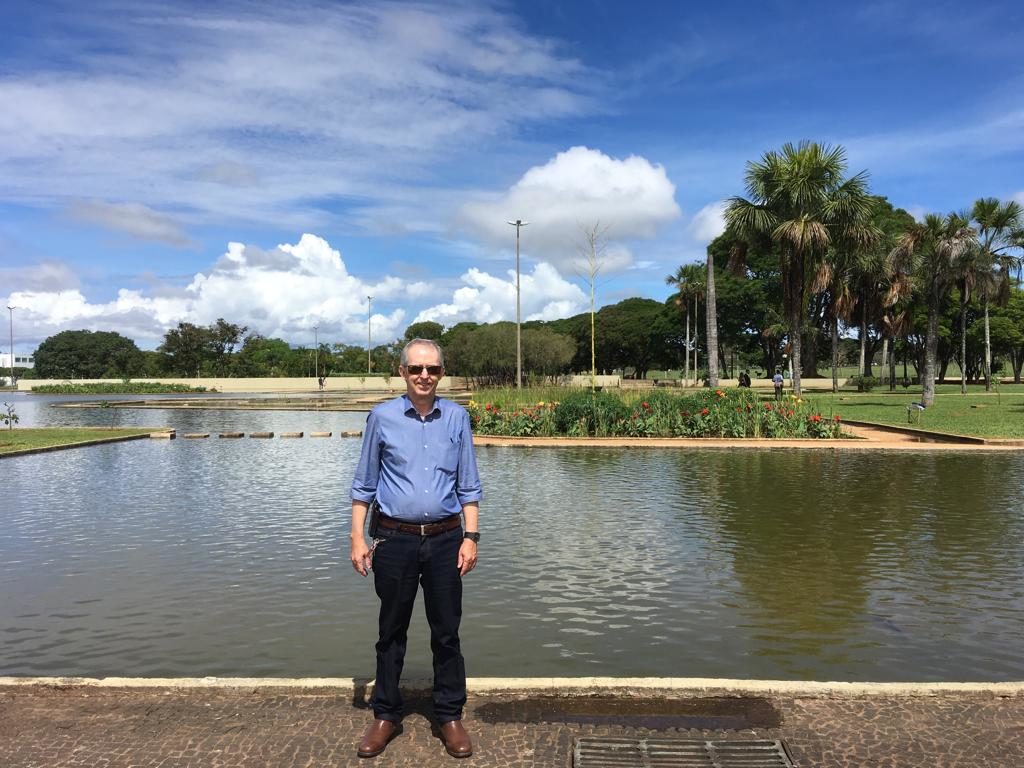 Man standing in front of a waterway