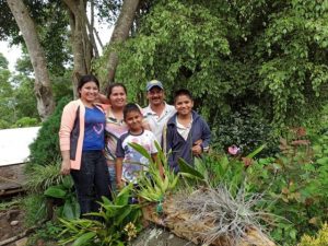 Family standing outdoors in Colombia