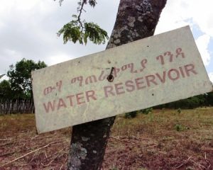 sign that says "water reservoir" nailed to a tree