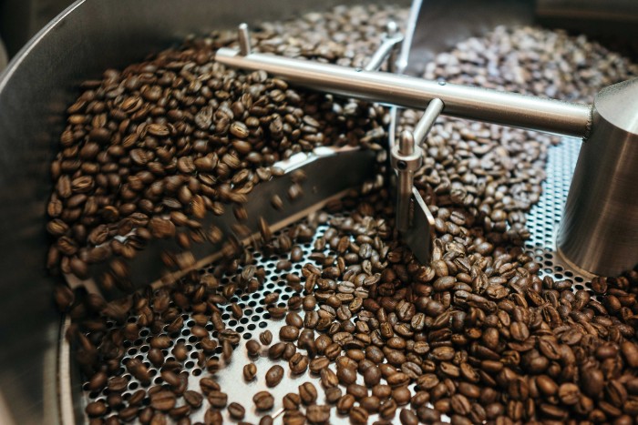 Drum coffee roaster stirring beans